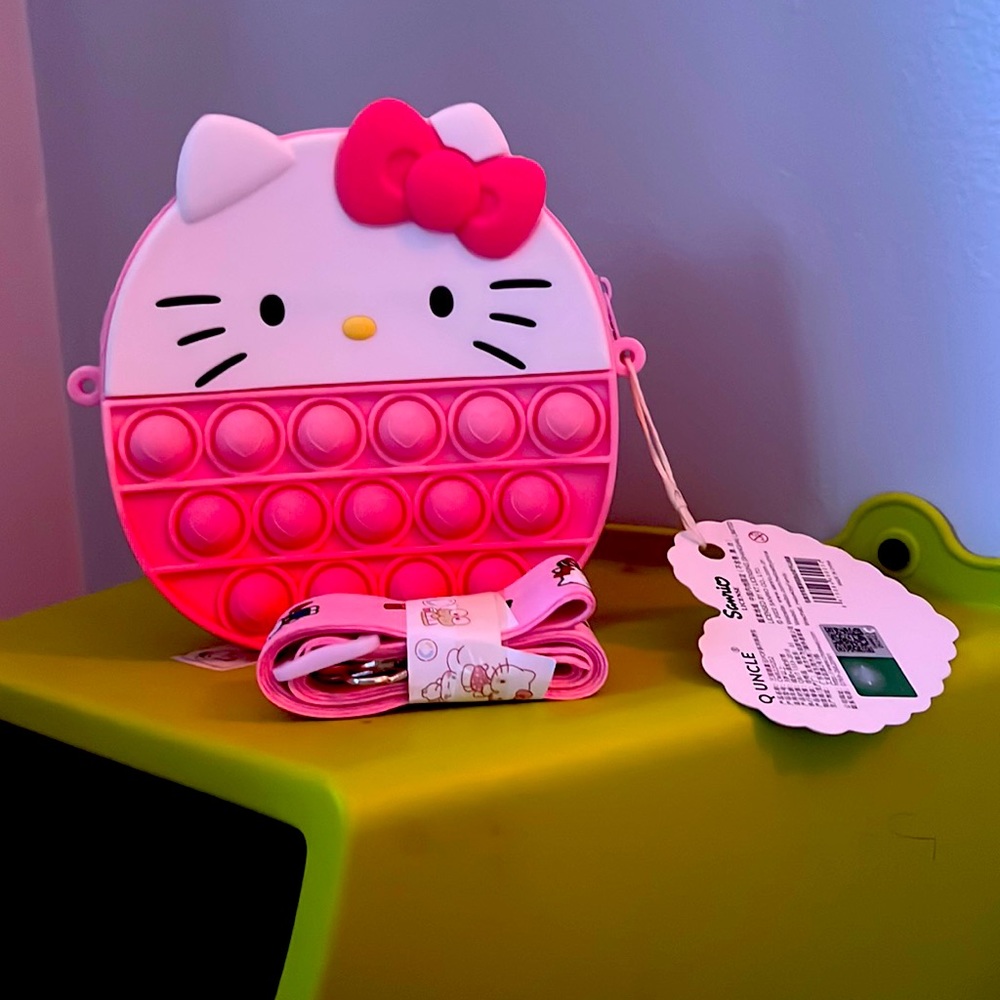 A Hello Kitty pop it purse
